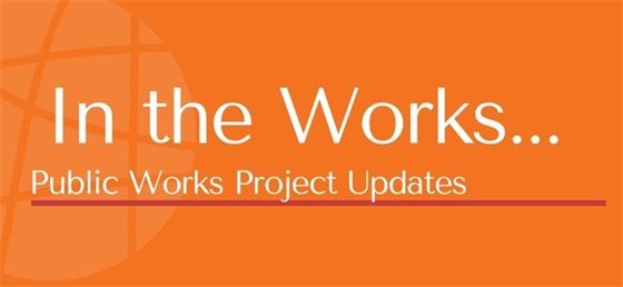 The text on the orange background reads "In the Works... Public Works Project Updates" with a thin red line below the second line of text.