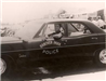 1969 Photo of Retired Lieutenant Raoul Hill Driving a 1966 Pontiac Catalina